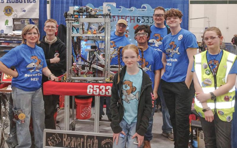 The BeaverTech robotics team poses for a group photo prior to beginning competition Friday at Midland Dow High School.