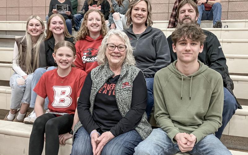 Viola Rusconi (back row, center), a participant in the Rotary Youth Exchange Program from Lecco, Italy, watches Monday night’s Beaverton basketball game with her hosts, the Stoike family. BEAVERTON