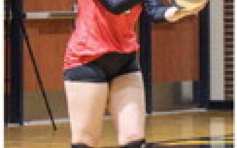 Kaelyn Fischer gets ready to serve against Shepherd.