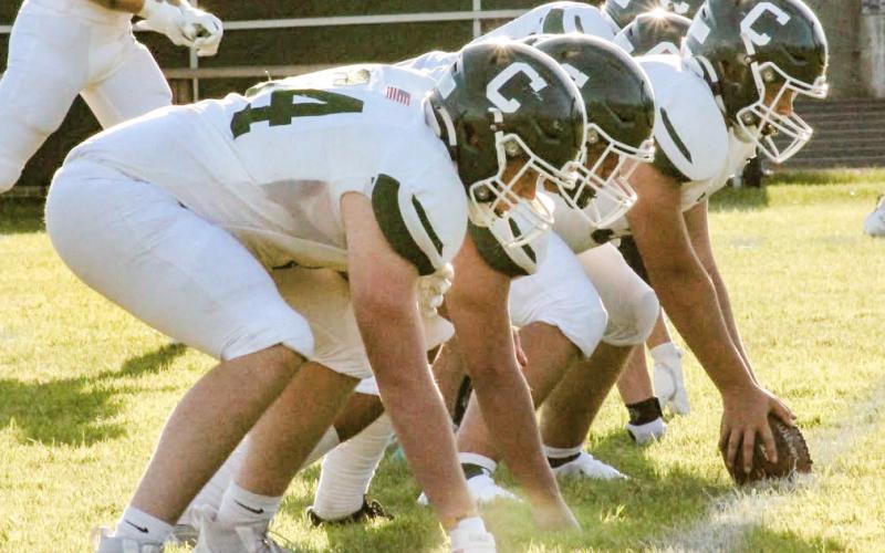 The Clare offensive line is ready for the snap Thursday night during the Pioneers victory at Grayling.