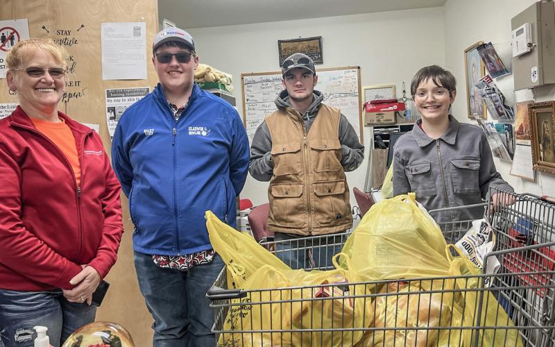 BOY SCOUTS DONATE FOOD TO SACRED HEART MISSION