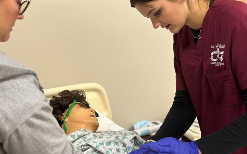 Alivia Harrell, a CTE Health Occupations student from Beaverton, develops patient care skills.