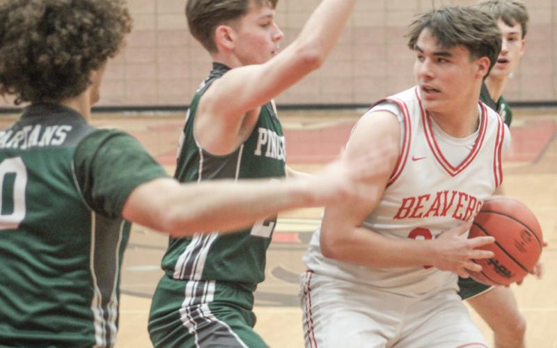 Landon Love looks for room amidst a sea of Pinconning defenders during Beaverton’s victory Friday night.