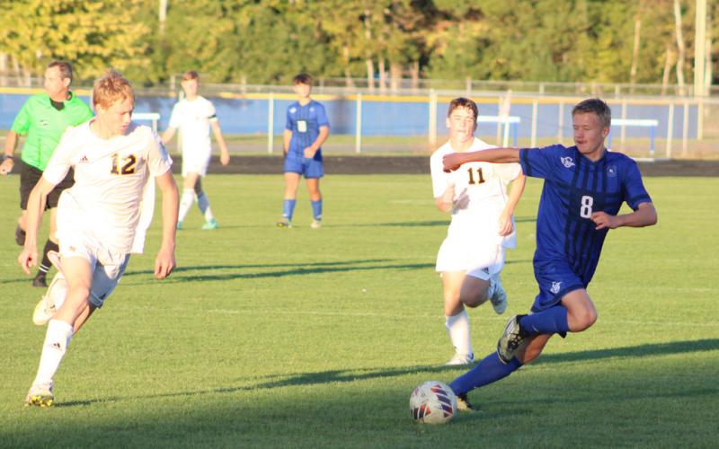 Gladwin’s Kaiden Smith shows Heisman Trophy form chasing the ball during Thursday’s battle with visiting Ithaca.