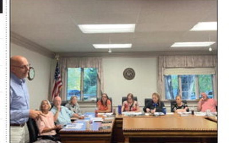 Gladwin Schools Superindent Chuck Frisbie addresses members of the Gladwin Couty Council.