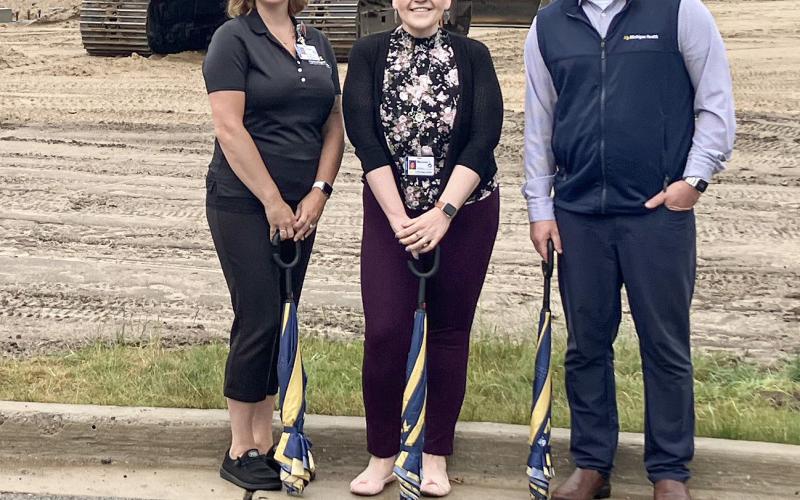 Construction is getting underway at the MyMichigan Health Park, where (left to right) Senior Manager for MMG Crystal Onweller, Work Site Supervisor Melonie Farley and Primary Care Service Line Director Brian Bates gathered for a photo in front of the expansion site. Inset photo, Ray Stover. GLADWIN