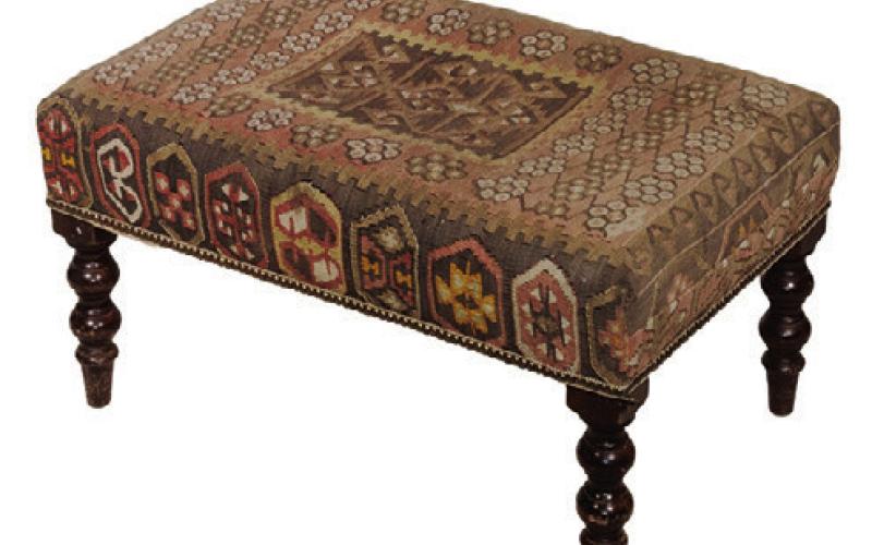 Rugs aren’t just for covering the floor. An antique kilim rug, a style originating in Western Asia, found another life as upholstery for a 20thcentury bench. THOMASTON PLACE AUCTION GALLERIES