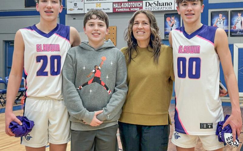 Getting together for a family photo at a previous Coaches Vs. Cancer event at Gladwin are (left to right) Brody, Blake, Courtney and Ben Verellen.