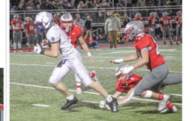 Gladwin’s Ike Wheeler breaks a tackle and heads into the clear after catching a pass during Friday night’s loss at Frankenmuth.