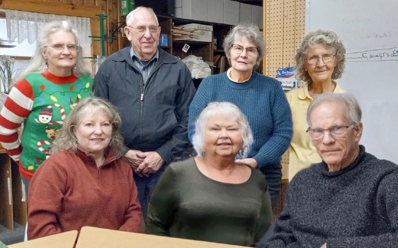 Pictured left to right, seated, are Connie Maedel Diehl, Linda Clark, and Mark Winslow. From left to right, standing, are Linda L. Hall, Ken Neubecker, Anne Cooke, and Patricia Riegle.