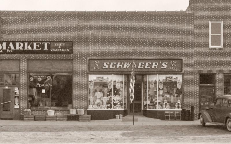 This building complex still stands on the south side of Cedar between Townsend and Silverleaf streets. The roof has been completely reconstructed and it has been remodeled several times since then. This building replaced previous structures that had been destroyed by a fire that destroyed most of the commercial block in 1936. Another fire in 1947 prompted the first major remodeling of this building.