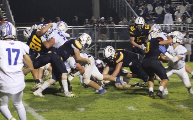 Gladwin’s Preston Willert plows through the middle of the Shepherd defense, which was pretty much his job description, during Friday night’s 25-14 victory.