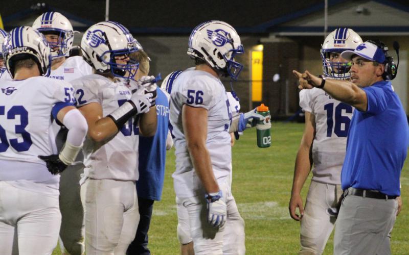 Gladwin assistant coach Kody Emeott makes a few suggestions to the students during a time out in the second half of Friday’s win at Shepherd.