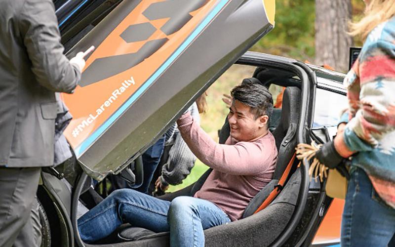 An attendee experiences what it’s like behind the wheel of a McLaren at a prior Northwood University International Auto Show. Some of the highlighted vehicles at this year’s show will include the Ferrari LaFerrari, Koenigsegg Agera RS, and Hennessey Venom F5. The show also will feature expanded entertainment offerings.