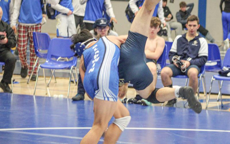 Gladwin’s Cruz Balcirak takes a Traverse City St. Francis opponent for a ride on his way to a 10-2 major decision at 132 during the team tournament hosted by the Flying G’s Saturday.