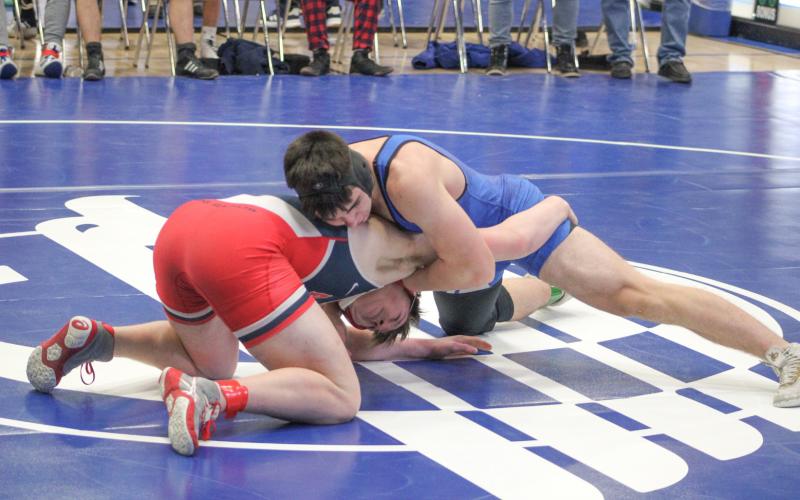 Gladwin’s Chase Green works his way to a hard-fought decision over Big Rapids at 175 during Saturday’s team tournament at Gladwin.