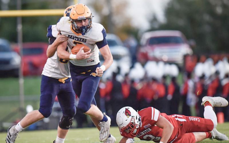 Joe Bellor takes the hand-off and looks for running room during Standish-Sterling’s 53-14 loss at Millington Friday night. PHOTOS COURTESY OF MINDY STOKOSZYNSKI