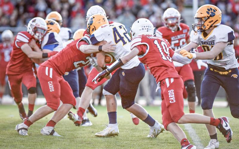 Standish-Sterling’s Rylee Blanchard is wrapped up by a Millington tackler during Friday night’s loss to the Cardinals. PHOTOS COURTESY OF MINDY STOKOSZYNSKI