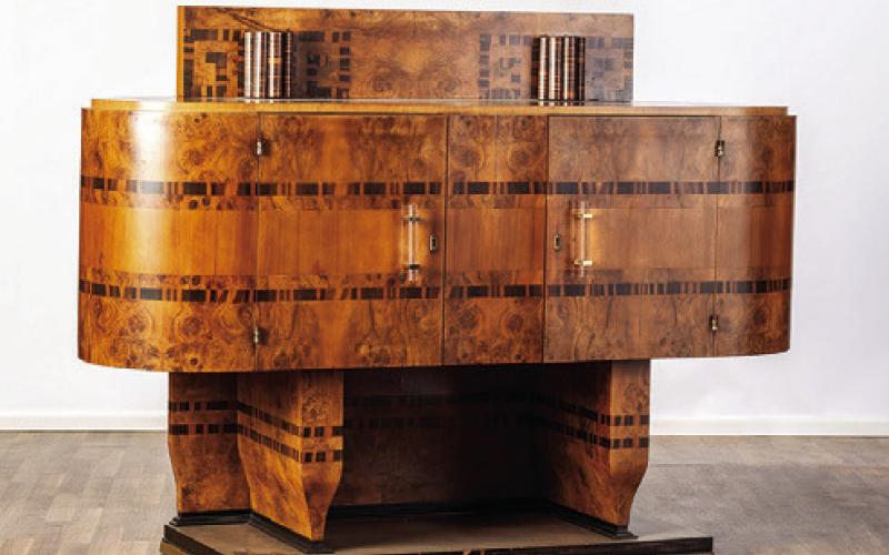 The art deco period began about 100 years ago and has not lost its appeal. This geometric cabinet with wood veneers is an example of the style. KOVELS.COM