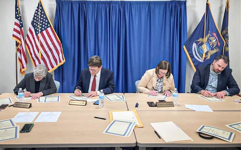 The Michigan Board of State Canvassers signed certificates to officially certify the results of the 2024 General Election. Pictured from left to right: Chair Mary Ellen Gurewitz (D), Vice-Chair Richard Houskamp (R), member Jeannette Bradshaw (D), and member Anthony Daunt (R).