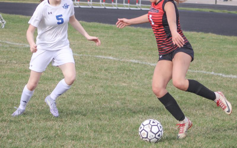 Beaverton’s Piper Carland tries to elude the defense of Gladwin’s Hallee LaBrosse during the Beavers win last week.