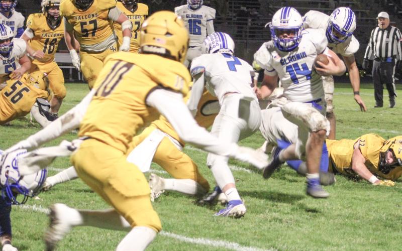 Preston Willert races out of the backfield during Gladwin’s 28-19 victory at Ogemaw Heights Friday night in the second round of the Division 5 playoffs.