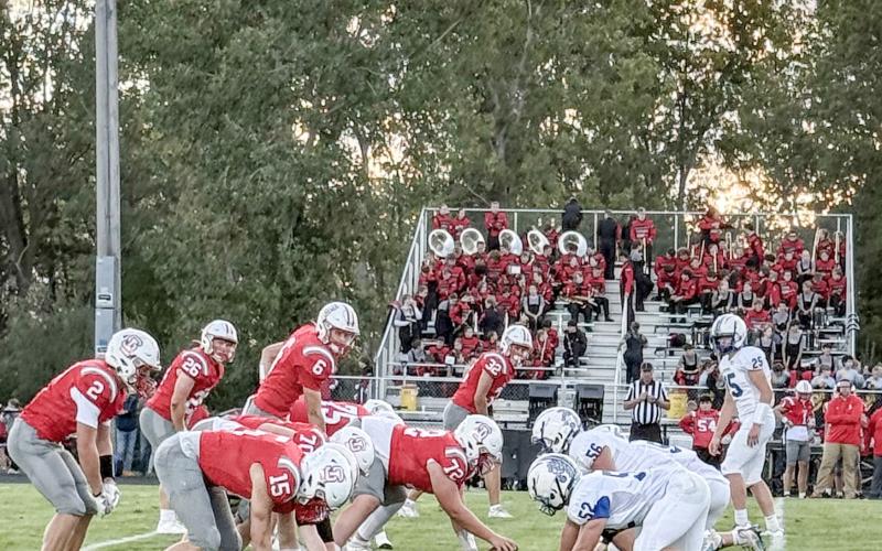 The Gladwin defense digs in prior to the snap on a rough night at Spring Lake. The Flying G’s will shoot for their first win Friday night when they host Jack Pine Conference rival Ogemaw Heights.