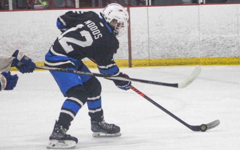 Gladwin’s Parker Woods lines up a backhander as he cuts in on goal during a recent game.