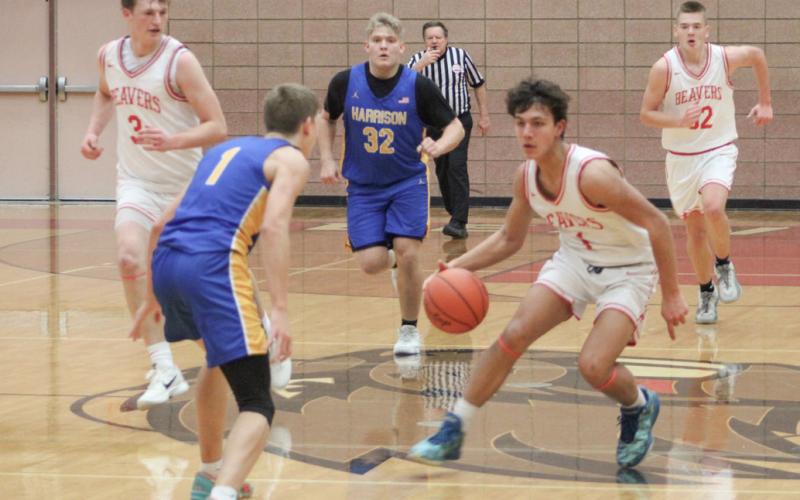 Beaverton’s Sean Barta makes a move near the time line on his way into the Harrison zone during Friday night’s victory.