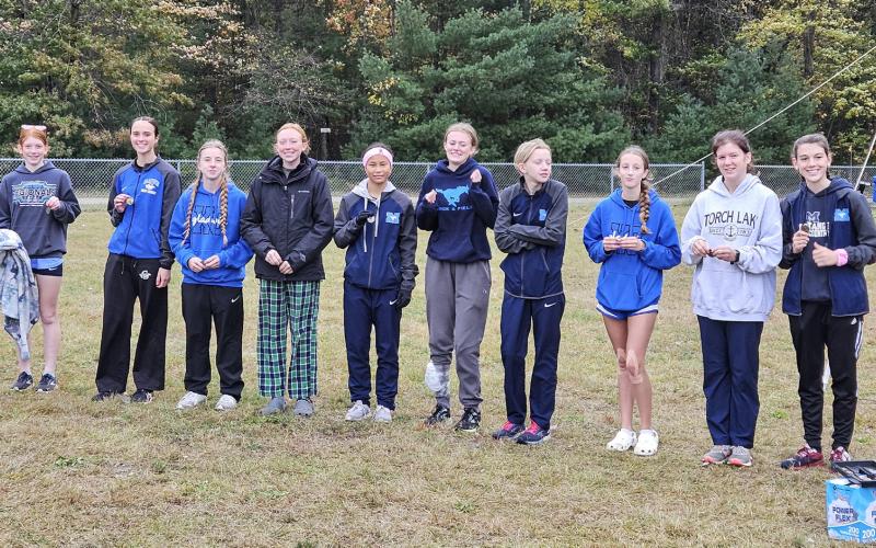 Gladwin’s girls’ cross country team tied host Meridian for the title at the Coach Cole Memorial Invitational Saturday.