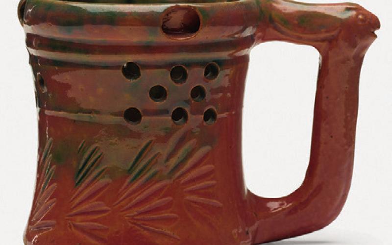 George E. Ohr’s pottery can be recognized by its thin clay, vividly colored glaze and an overall sense of eccentricity.
