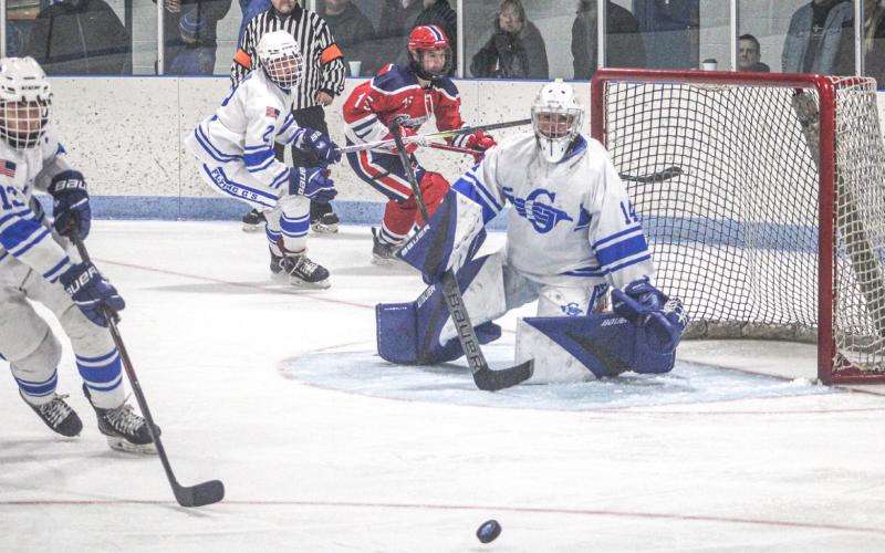 Goalie Preston Willert keeps his eyes on the bouncing puck during Gladwin’s victory over visiting Genesee.