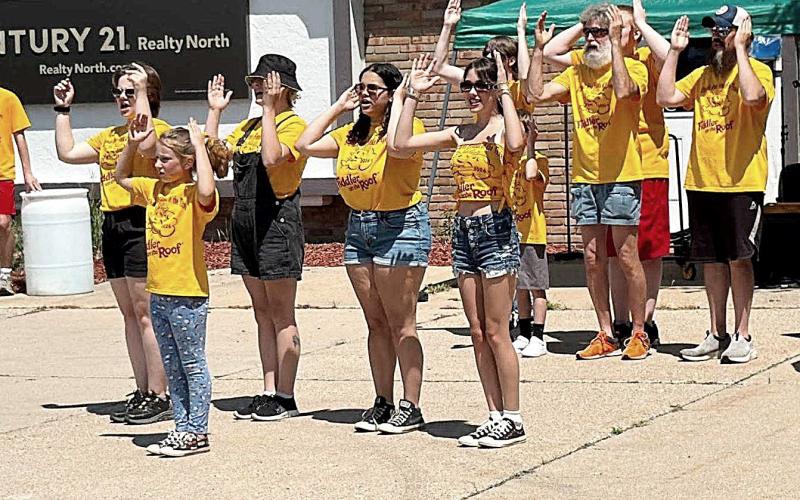 Gladwin Area Friends of the Theatre performing a song from Fiddler On The Roof during the Gladwin Street Fair on July 11.