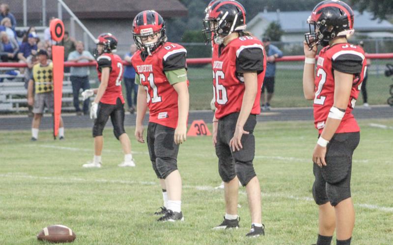 Beaverton’s (left to right) Sawyer Gordert, Angel Cerda and Logan Klimkiewicz prepare for the snap during a recent junior varsity game.