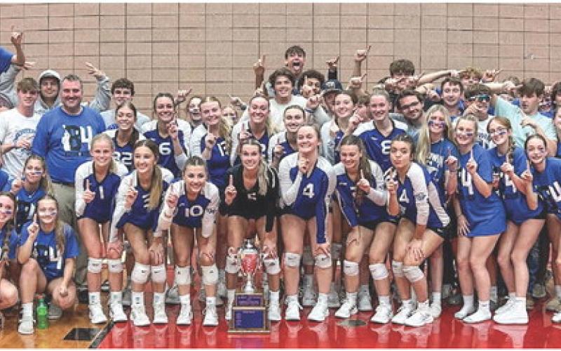 The student section is pictured with the team after the win bringing the Cedar Cup back to Gladwin.