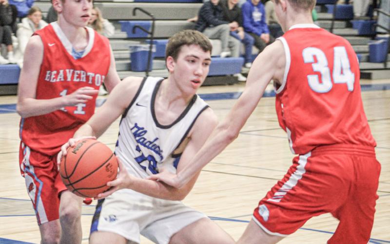 Gladwin’s Brody Verellen battles in the paint during last Tuesday night’s victory over Beaverton in the Battle For Butch.