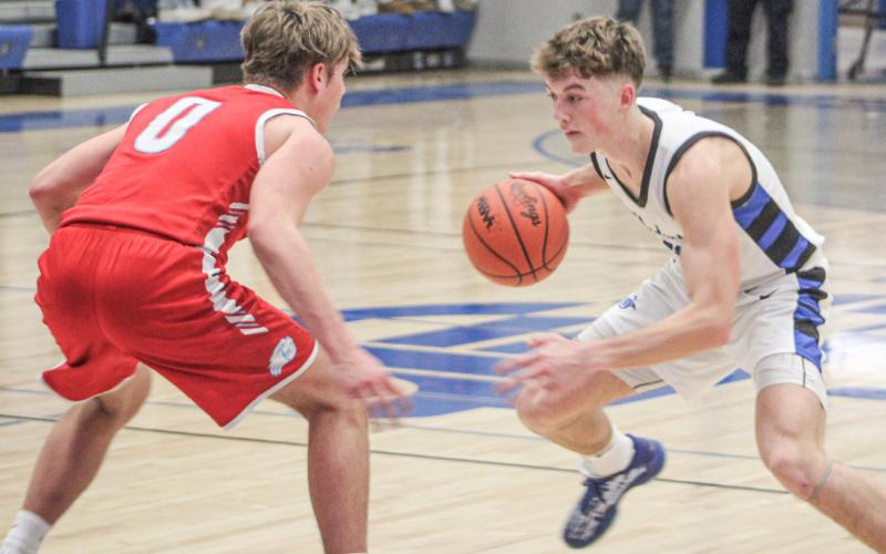 Gladwin’s Seth Mead puts a move on Beaverton’s Caiden Loar during last Tuesday night’s victory in the Battle for Butch.