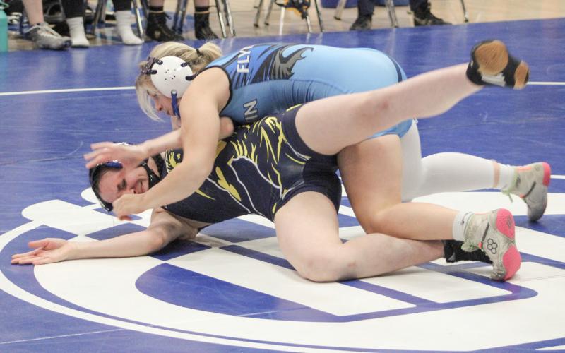 Gladwin’s Lily Miller battled to a second-place finish at 135 at the individual district tournament Sunday to qualify for this weekend’s regional.