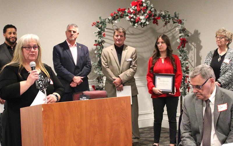 Executive Director Yvette Keast accepts the Inspiring Community Partner of the Year Award at the Alumni Celebration on December 8 at Riverwalk Place.