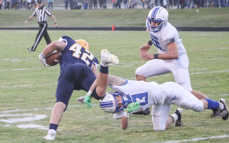 Gladwin’s Brady Dickinson tackles a Standish ball-carrier during Friday night’s 33-20 victory, which snapped a two-game losing streak.