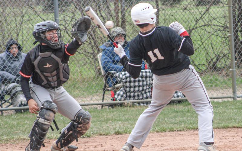 Beaverton’s Landon Love avoids a little chin music during Saturday’s Dar Grove Baseball Tournament.