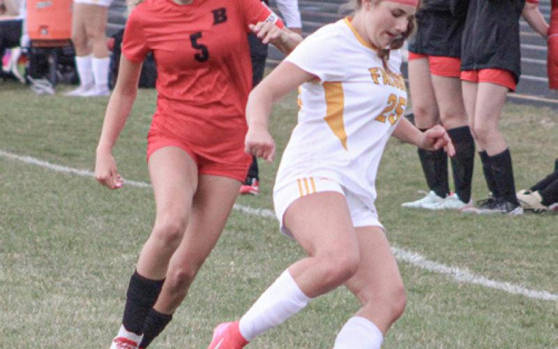 Beaverton’s Piper Carland battles for the ball with an Ogemaw Heights defender last week.
