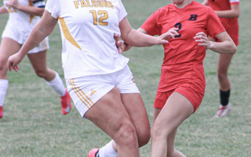 Emily Skotynsky runs into resistance in the box during last week’s loss to Ogemaw Heights.