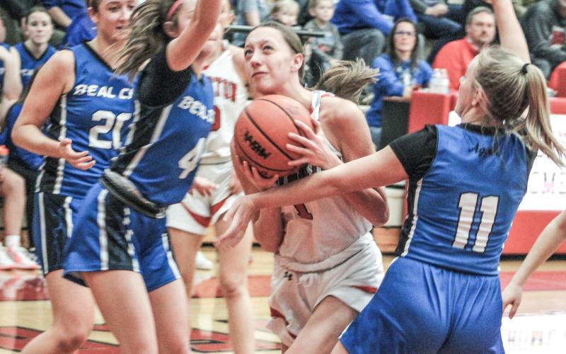 Beaverton’s Trinity Danielak fights her way through the Beal City defense during last Wednesday night’s overtime loss to the Aggies in the Division 3 district semifinals.