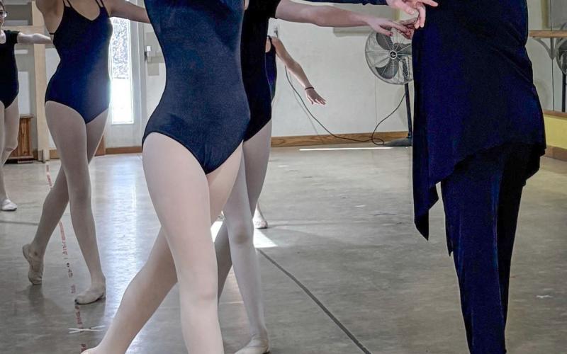 Grade I students clean their arabesque. Pictured with Ms. Bethany is Bryssa Delisle and Ava Adame.
