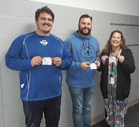 Gladwin Intermediate School teachers, Ethan Gary, Dominic Lake, and Sofia Kruske, hold the candy bars of appreciation they received from MARSP-Gladwin County Chapter.