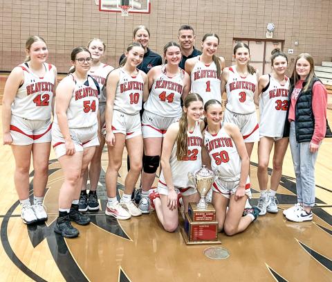 The Beaverton girls’ basketball players and coaches posed with the hardware after beating rival Gladwin for the Cedar Cup last Wednesday.
