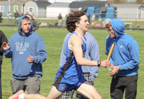 Gladwin’s Myles Robinson opens up a lead running the second heat of the 1600 relay Saturday at the Jack Pine Conference Meet at Pinconning.