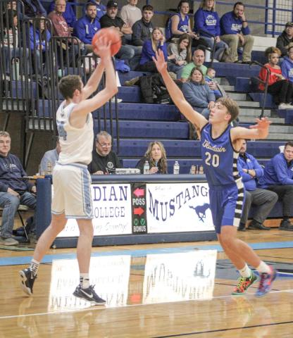 Gladwin’s Brody Verellen applies defensive pressure during last Wednesday’s season-opener at Meridian.