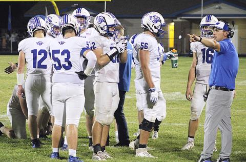 Kody Emeott calls the shots during a time out last season. Emeott has moved up from Defensive Coordinator to Head Coach and will lead the Flying G’s for the first time Friday night at Flat Rock.